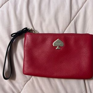 Red leather Kate spade wristlet with bow